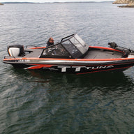 UMS 585DC fishing boat on open water, highlighting its robust design and advanced fishing equipment.