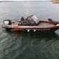 UMS 585DC fishing boat on open water, highlighting its robust design and advanced fishing equipment.