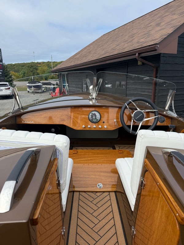 Canna One cockpit from the stern, with white bench seats and the windscreen