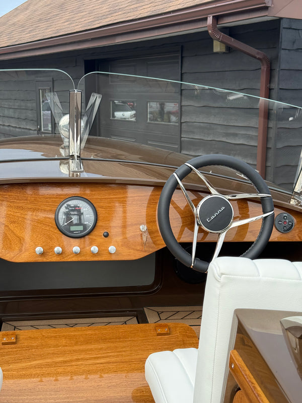 Canna One helm with the wooden dashboard, gauge, steering wheel and windscreen