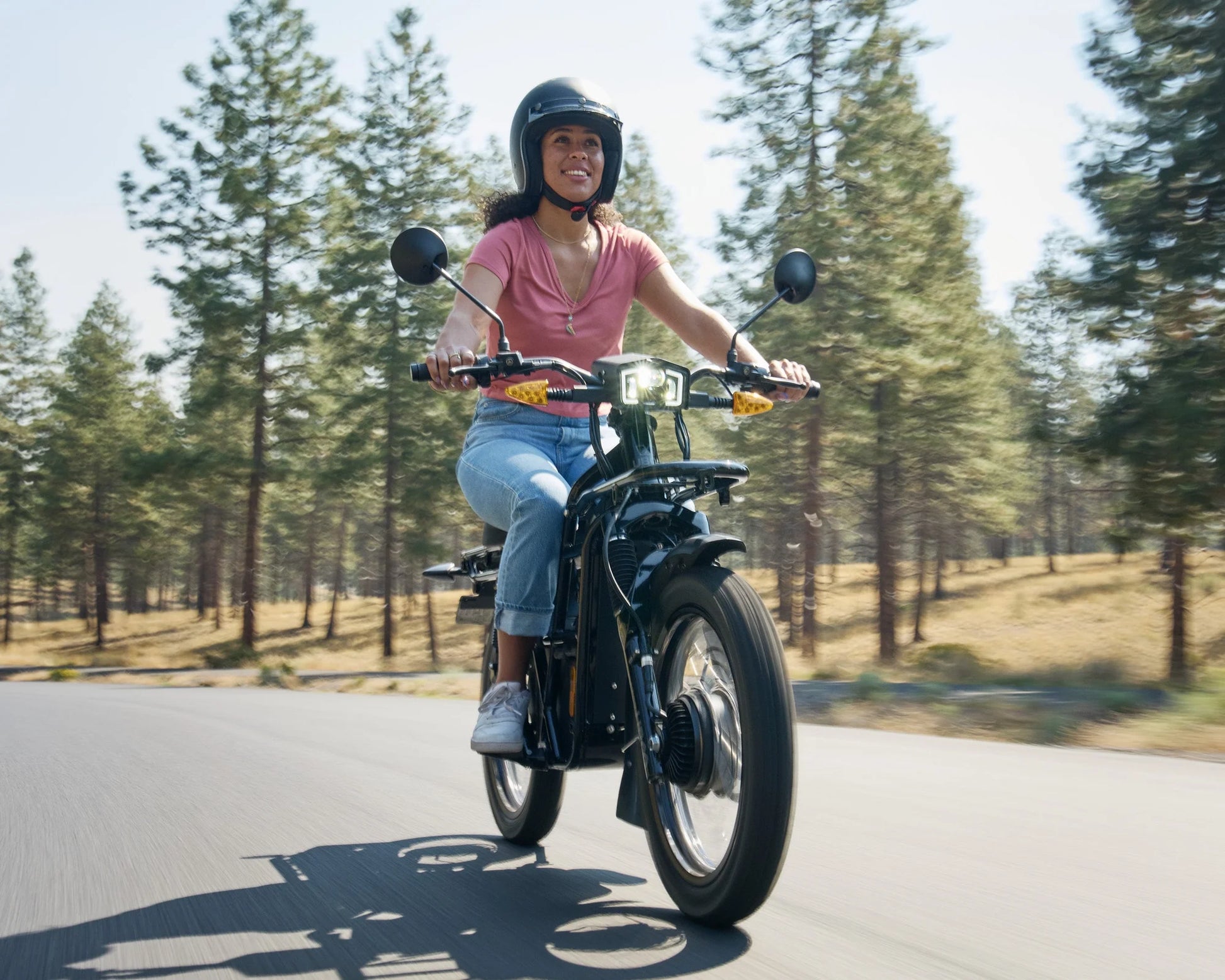 UBCO Adventure eBike 2x2 (Black) drives past the forest landing