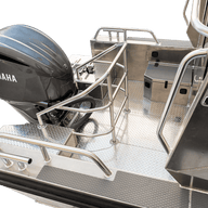 A rear view of the UMS 700HT 23.5ft aluminum boat, featuring a Yamaha outboard motor and a robust aluminum deck with anti-slip surfaces, protective railings, and a secure storage compartment.