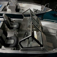 An overhead view of the Aluminum Boat UMS 485 DC, highlighting its spacious seating arrangement, dual consoles, and durable aluminum flooring, designed for comfort and functionality.