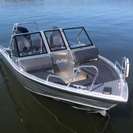 A sleek Aluminum Boat UMS 485 DC is shown docked on calm water, highlighting its modern design and spacious interior with dual consoles.