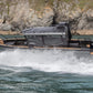 The UMS 700HT aluminum boat powering through the water at high speed.