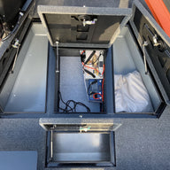 Fishing compartments in aluminum boat.