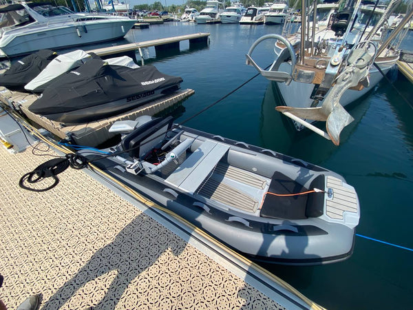 GALA Atlantis A360Q RIB at a marina dock with an ePropulsion Navy 6.0 Evo electric outboard, side console and bench seat
