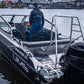 A man standing on the deck of the UMS 655 DC aluminum boat.