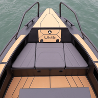 The bow of the UMS 700HT aluminum boat, featuring stylish and comfortable seating with vinyl coverings.