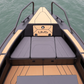 The bow of the UMS 700HT aluminum boat, featuring stylish and comfortable seating with vinyl coverings.